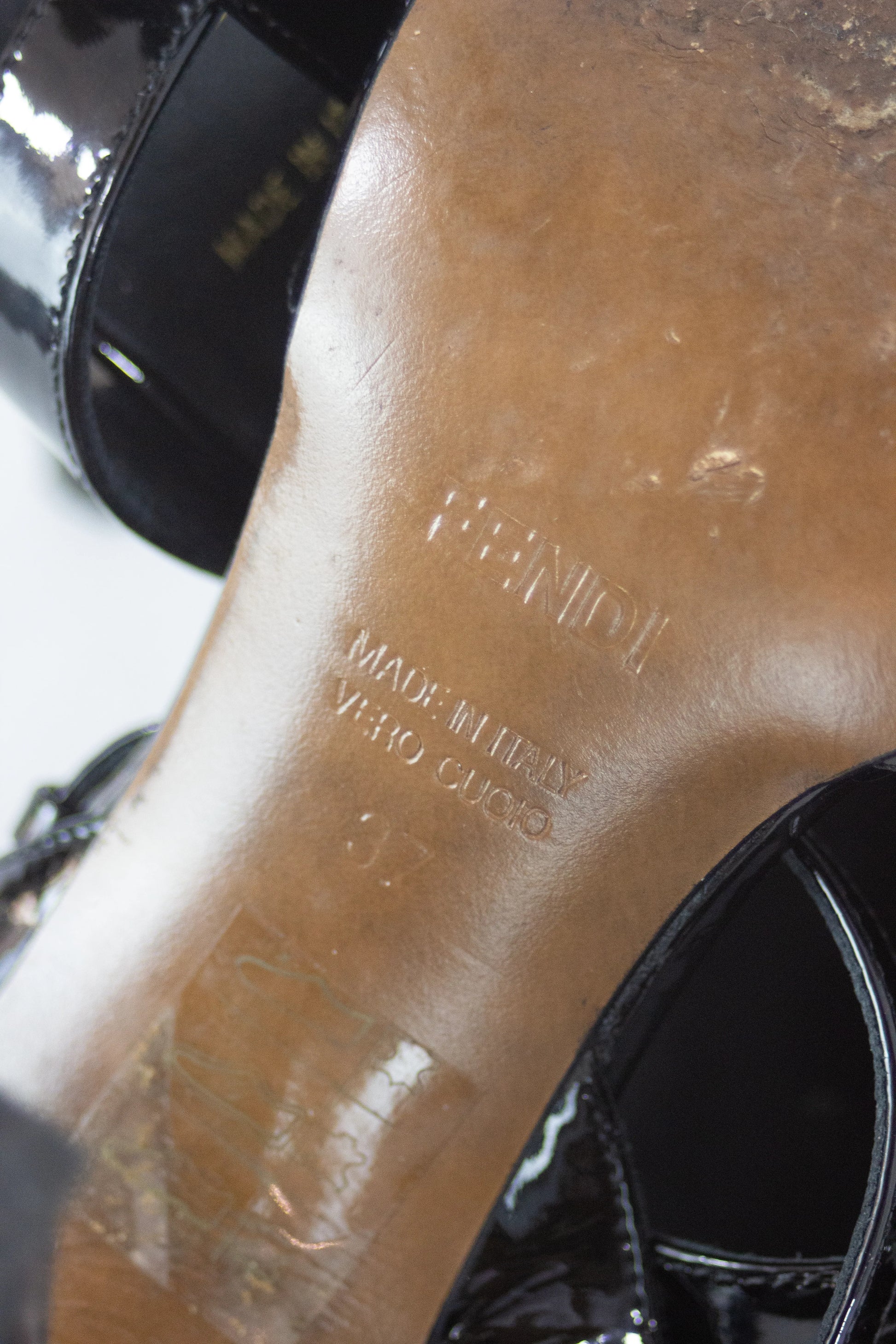 Black patent sandals with buckle decor