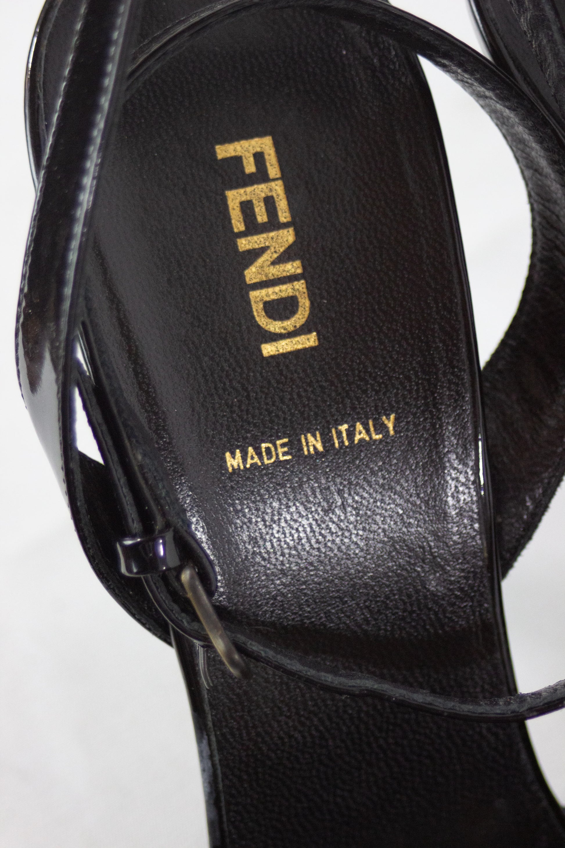 Black patent sandals with buckle decor