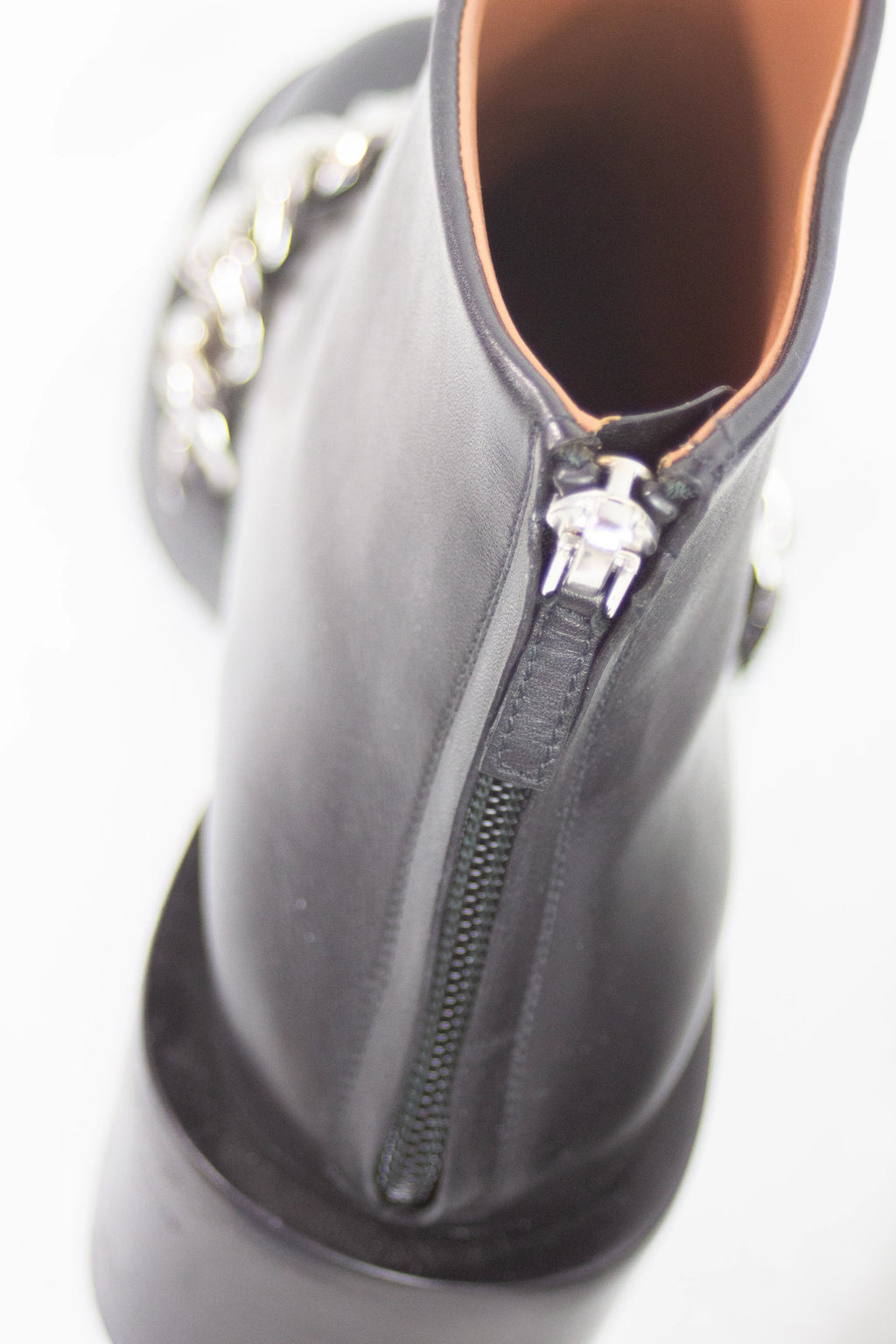 Black leather ankle boots with chain detail