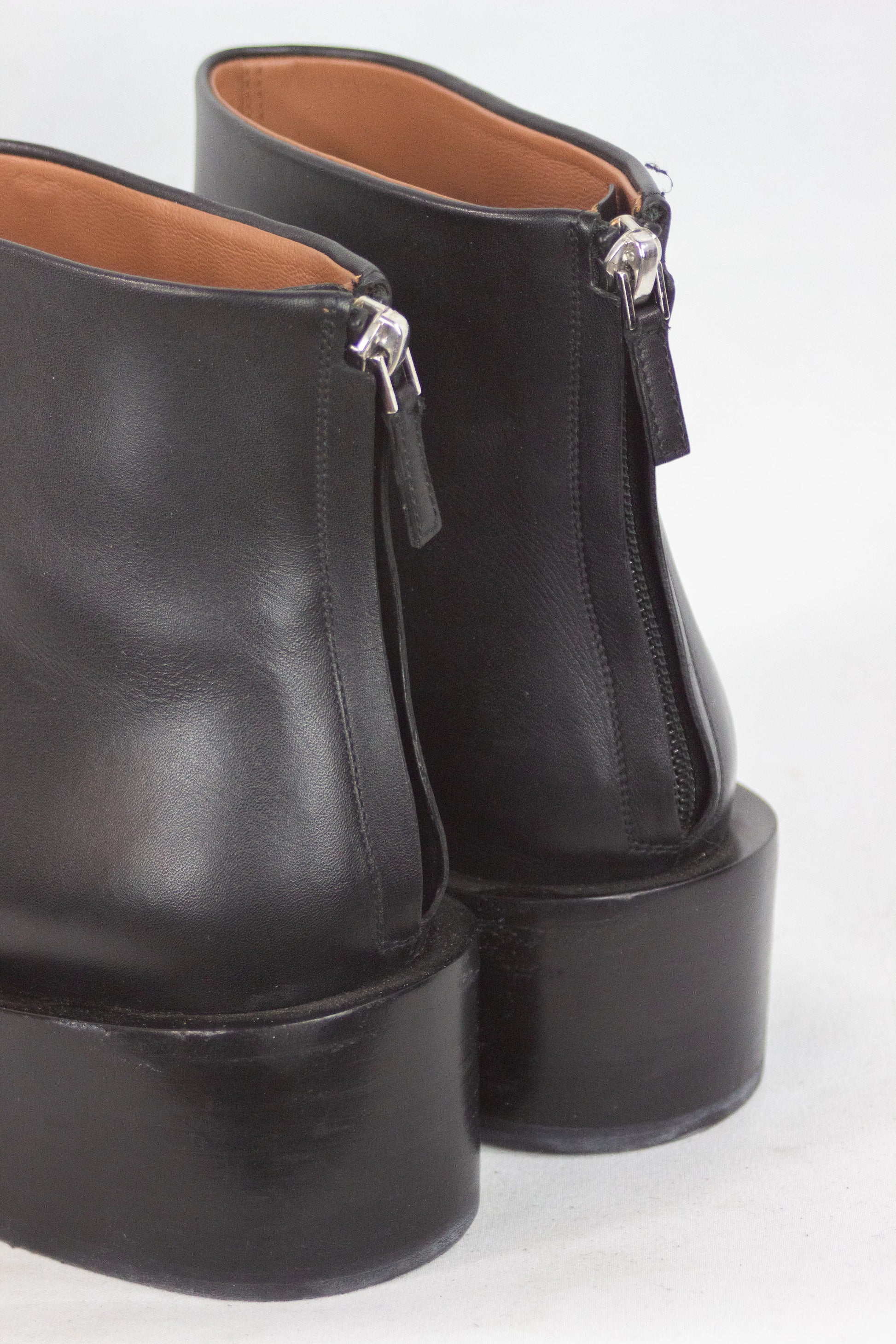 Black leather ankle boots with chain detail