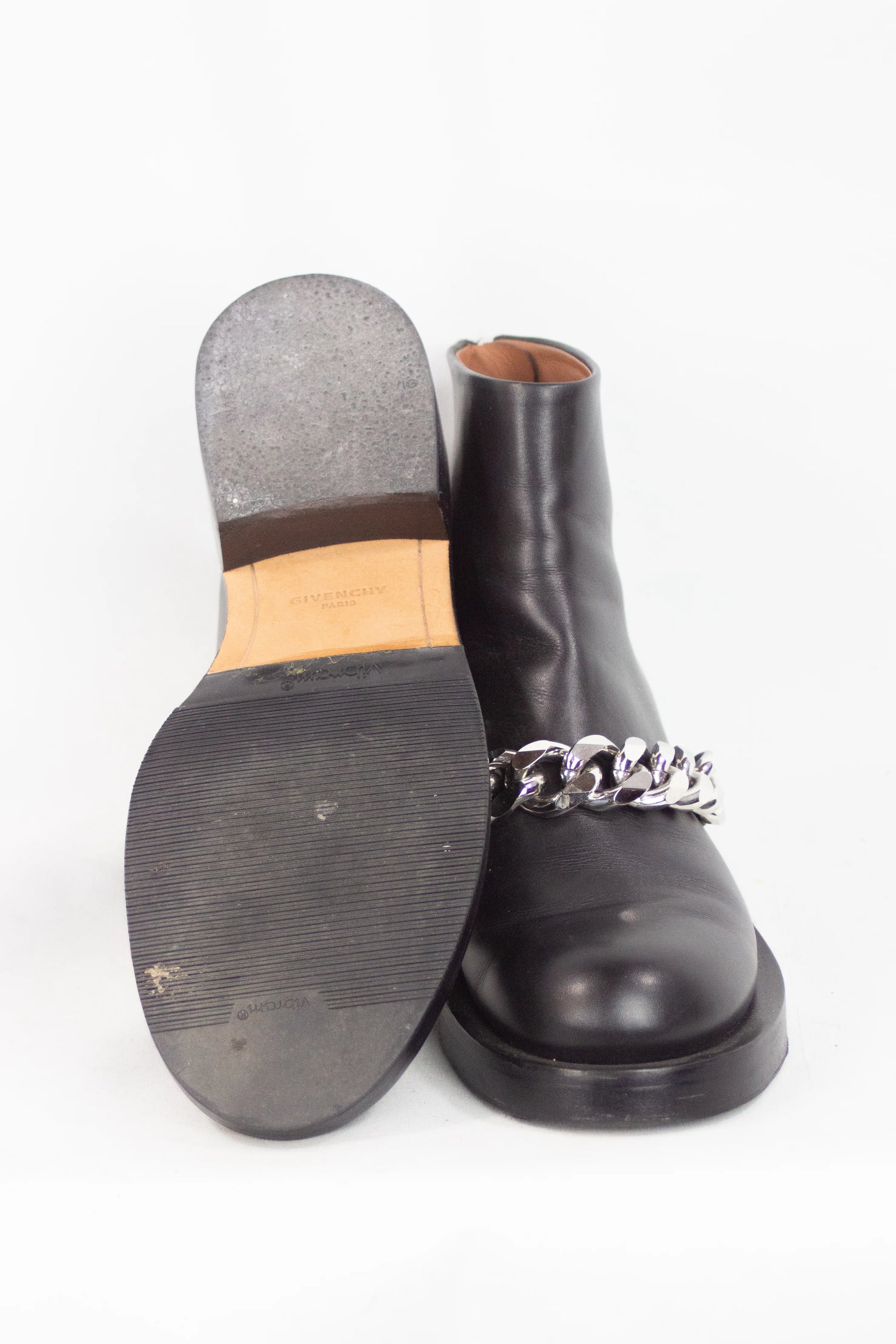Black leather ankle boots with chain detail