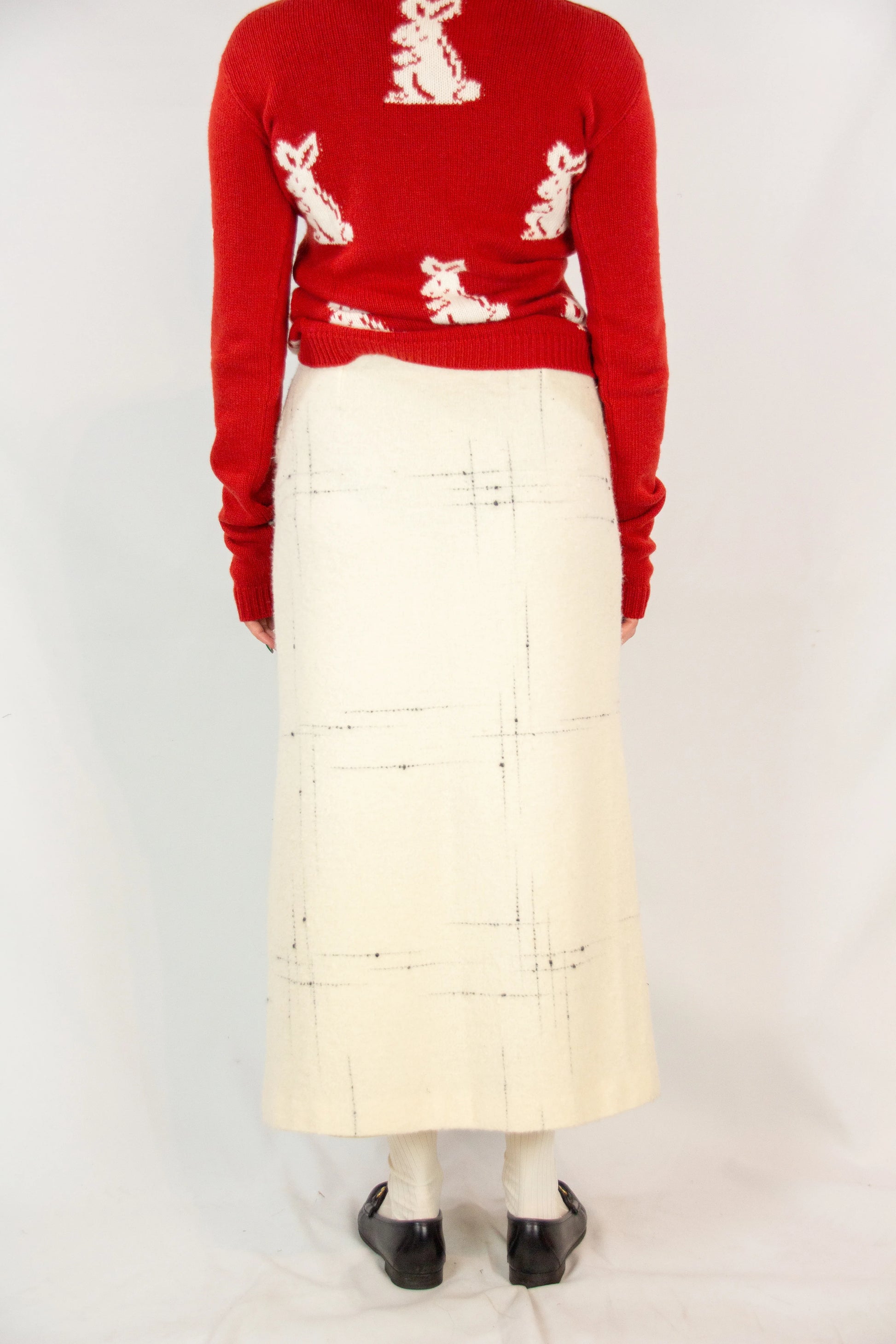 Wool wrap skirt with black stitching and leather closure