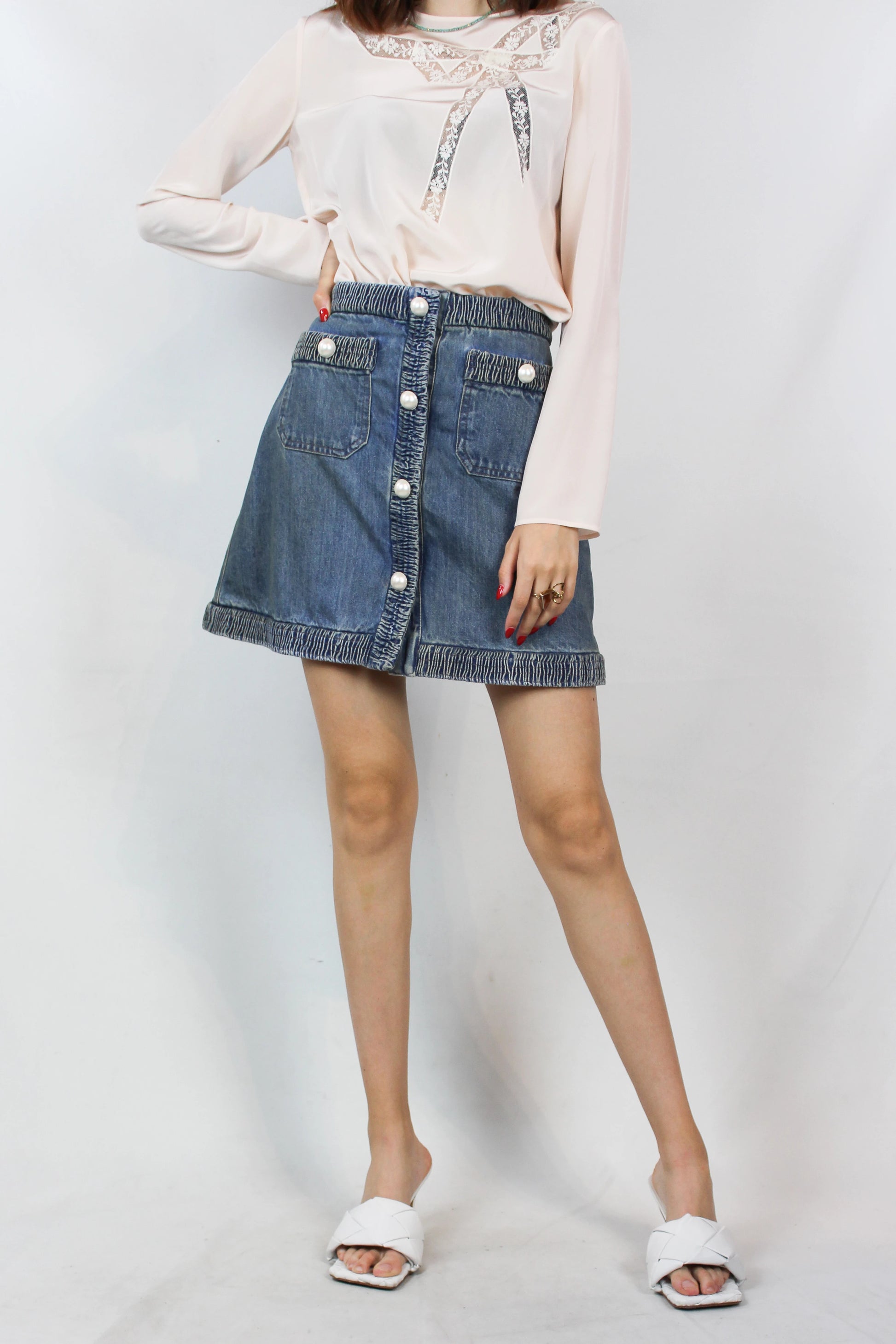 Denim mini skirt with pearl logo buttons