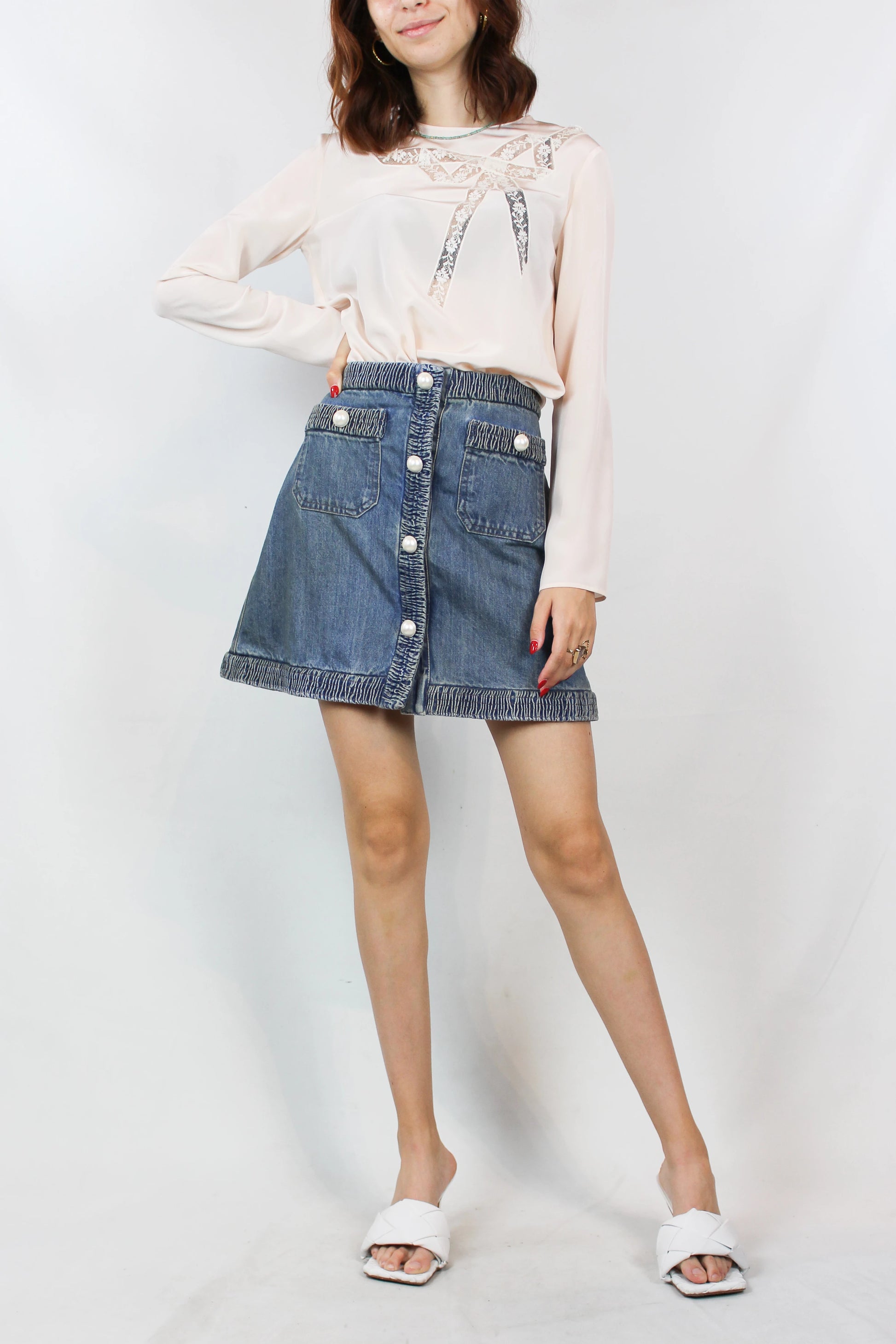 Denim mini skirt with pearl logo buttons