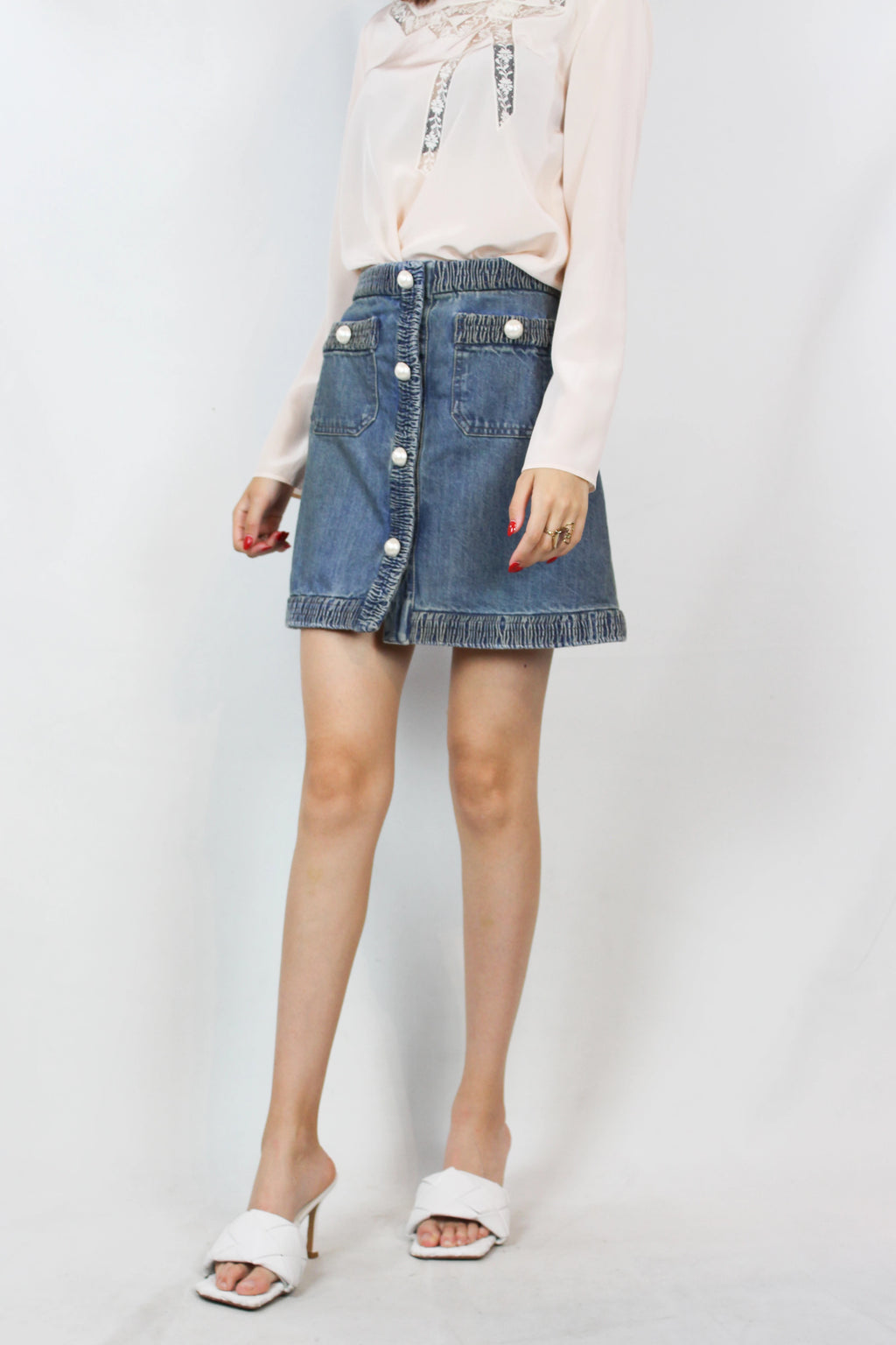 Denim mini skirt with pearl logo buttons