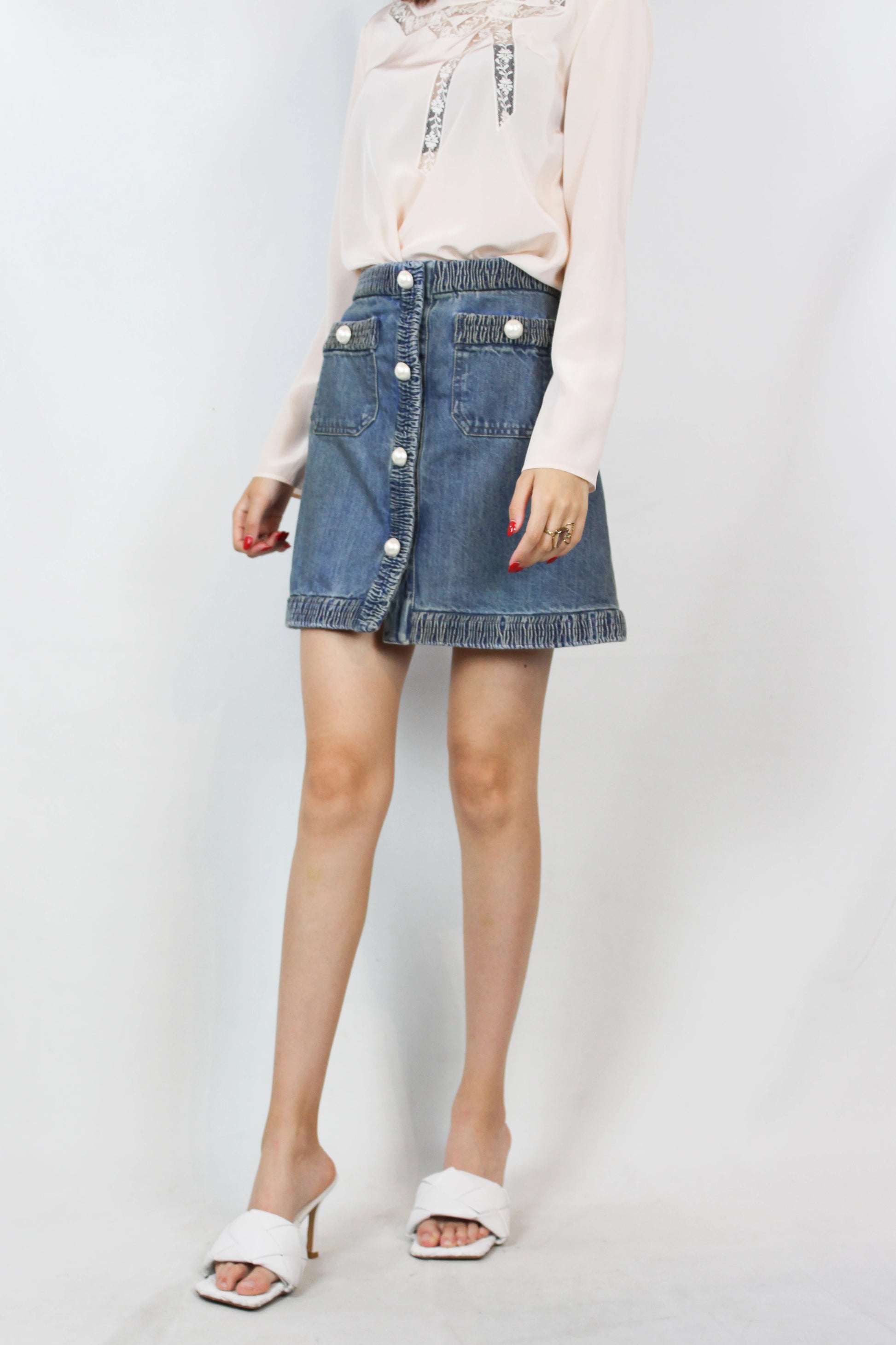 Denim mini skirt with pearl logo buttons