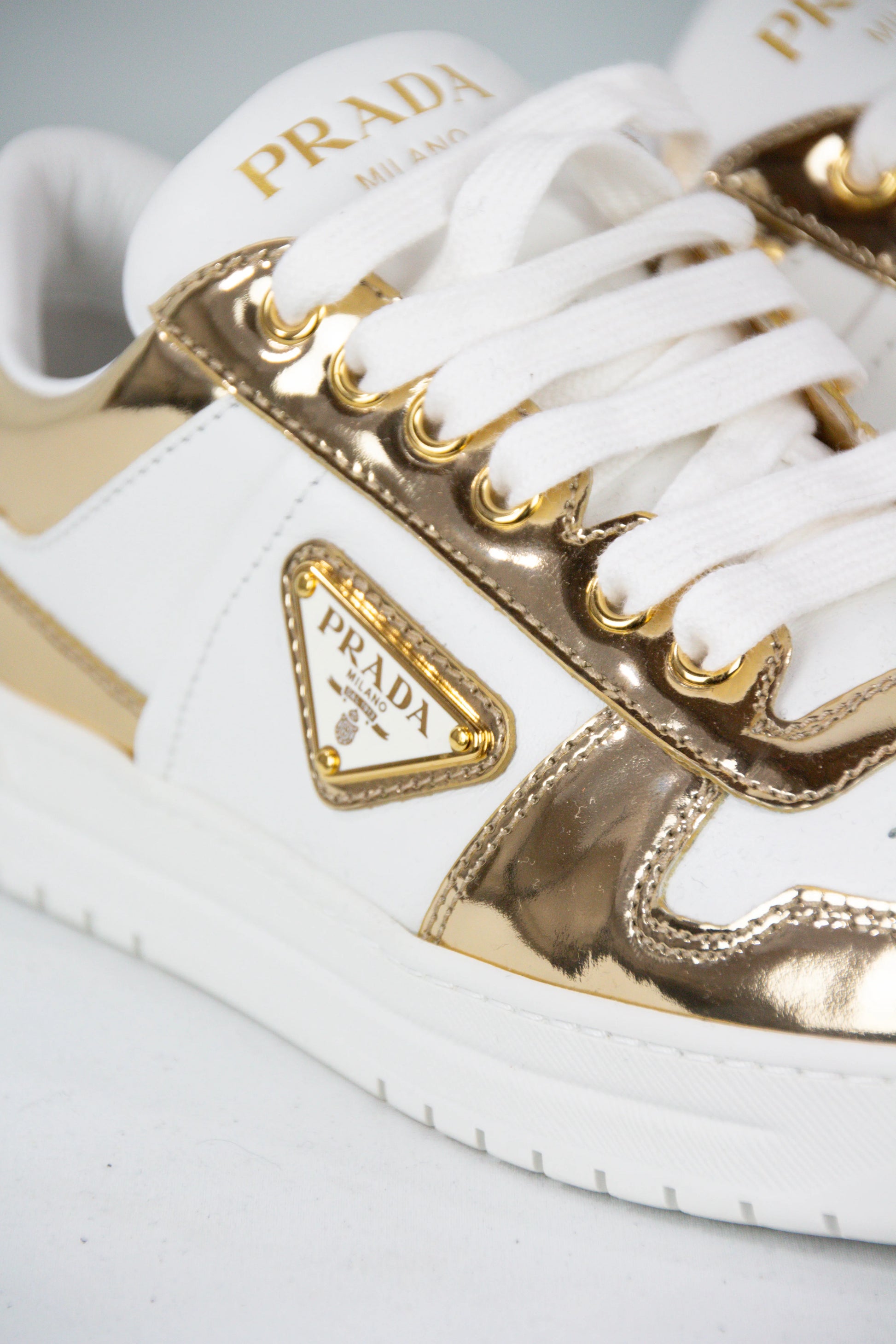 White and gold Downtown sneakers