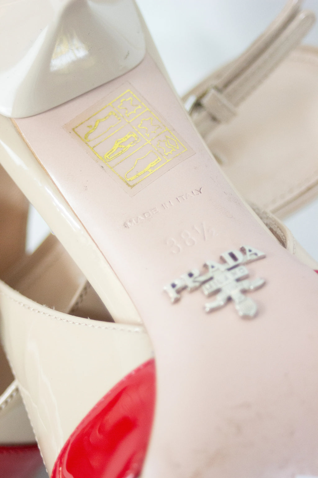 Cream patent pointed slingback