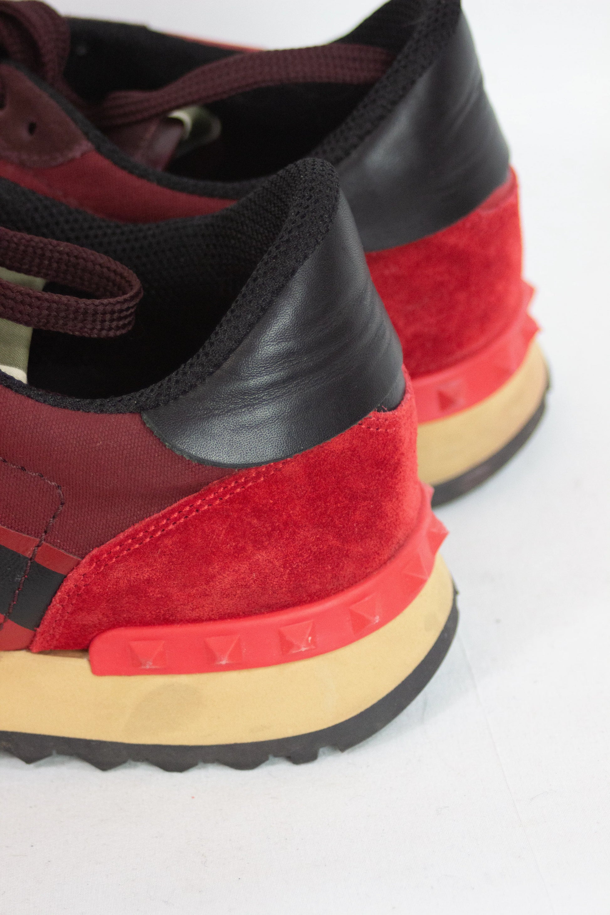 Red rockstud sneakers