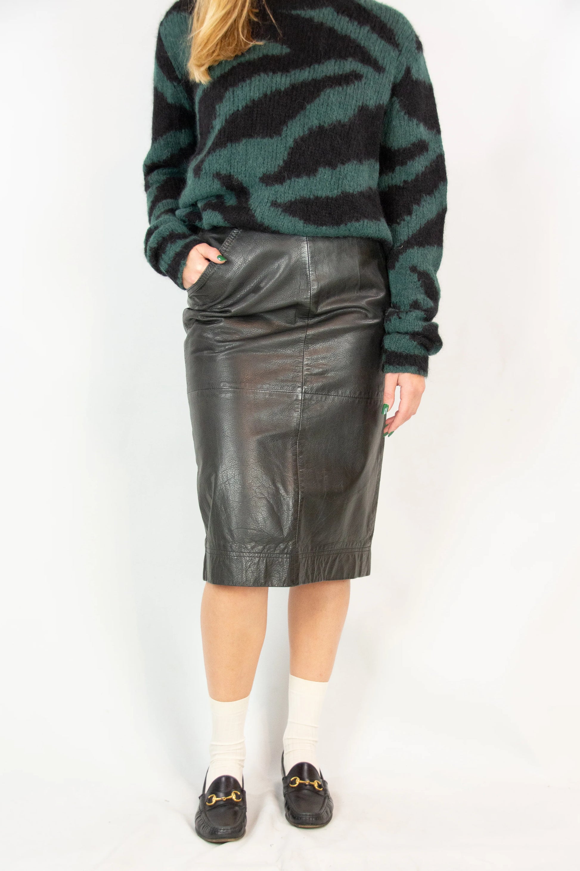 Black leather pencil skirt with back slit