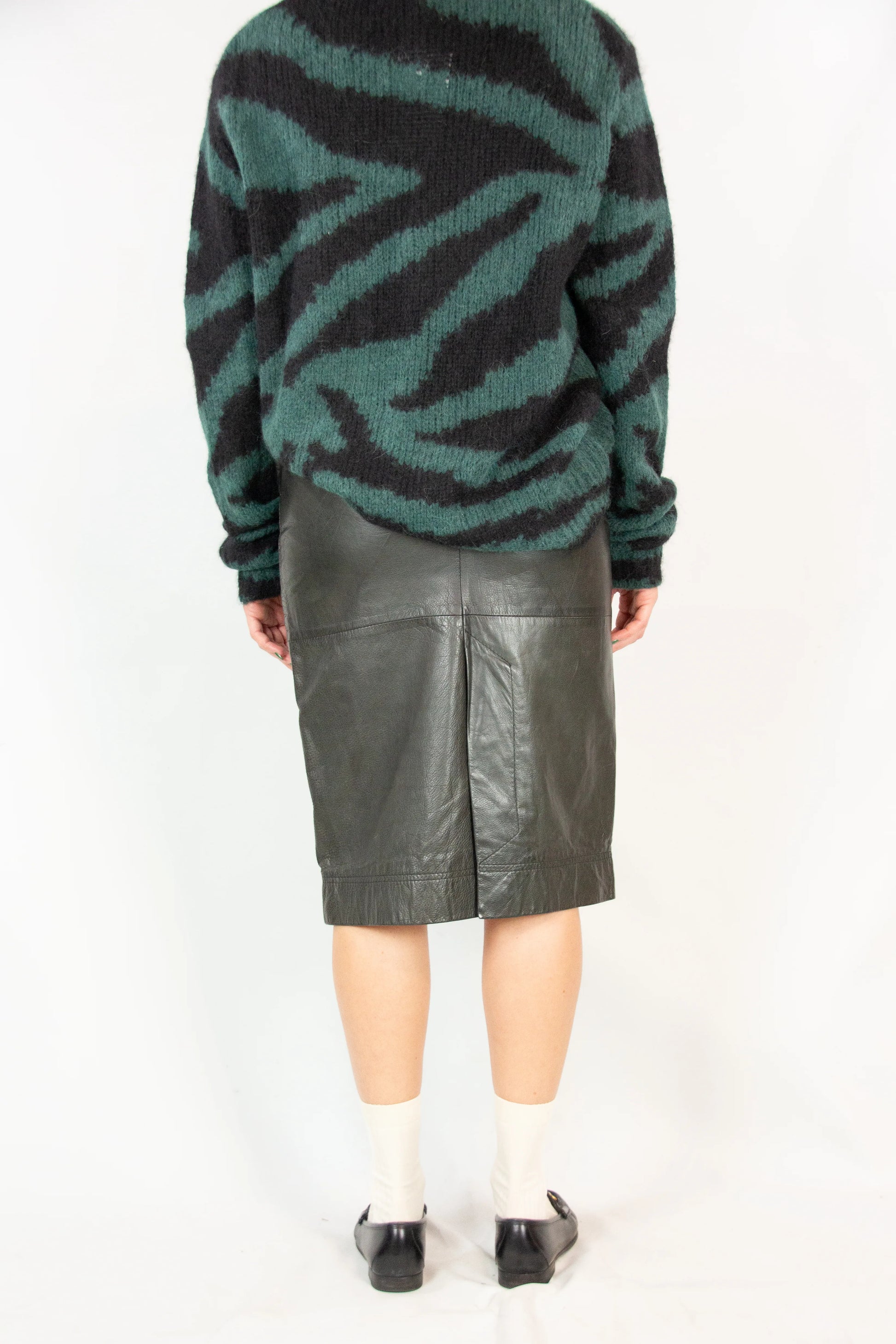 Black leather pencil skirt with back slit