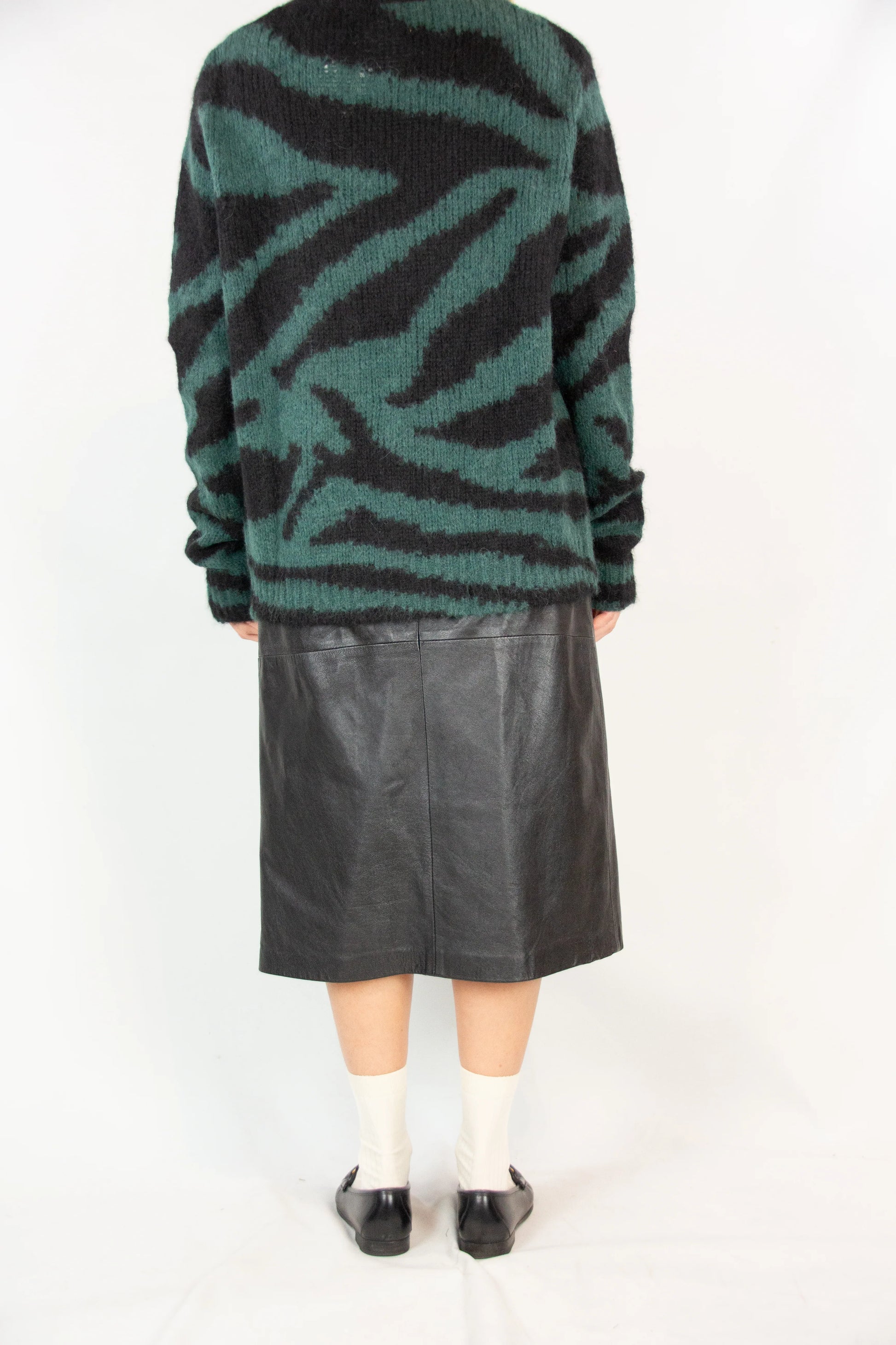 A-line leather skirt with high waist belt and inlay detailing
